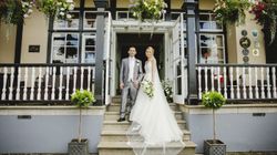 Bride and groom outside the hotel entrance