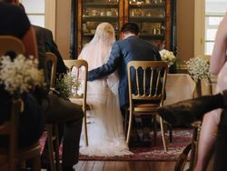 Bride and Groom sat at alter