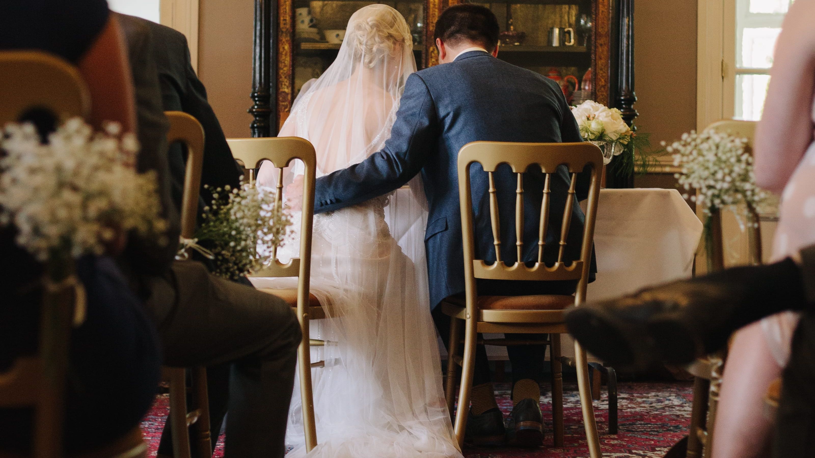 Bride and Groom sat at alter