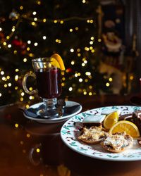 Plate filled with Christmas treats and a glass of mulled wine