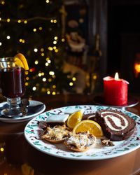 Plate filled with Christmas treats and a glass of mulled wine