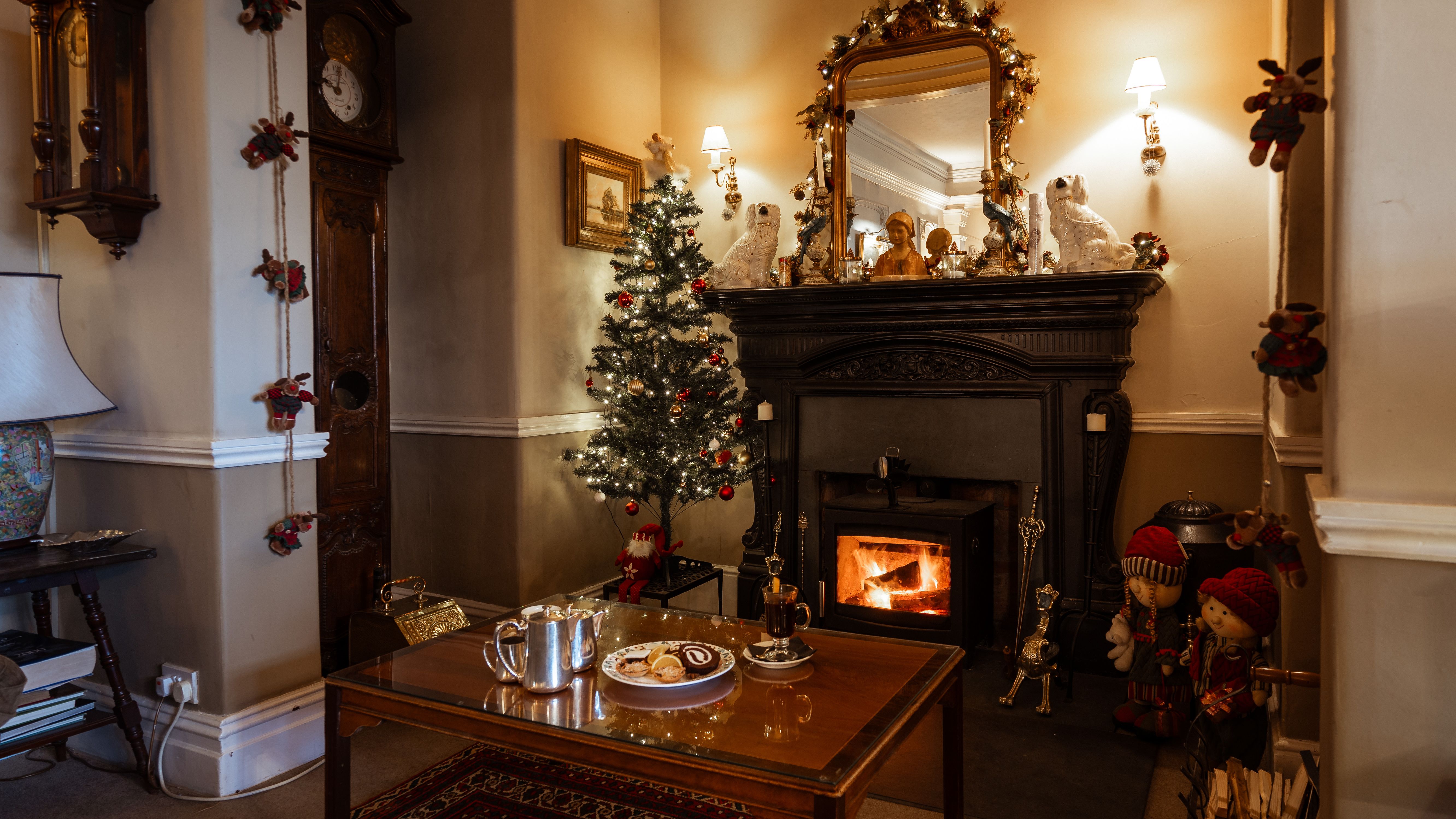 Fireplace covered with Christmas decorations