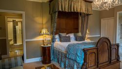 Large bed with green covers
