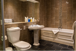 Bath and shower room with tiled floor and walls