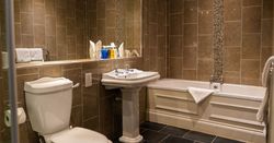 Bath and shower room with tiled floor and walls