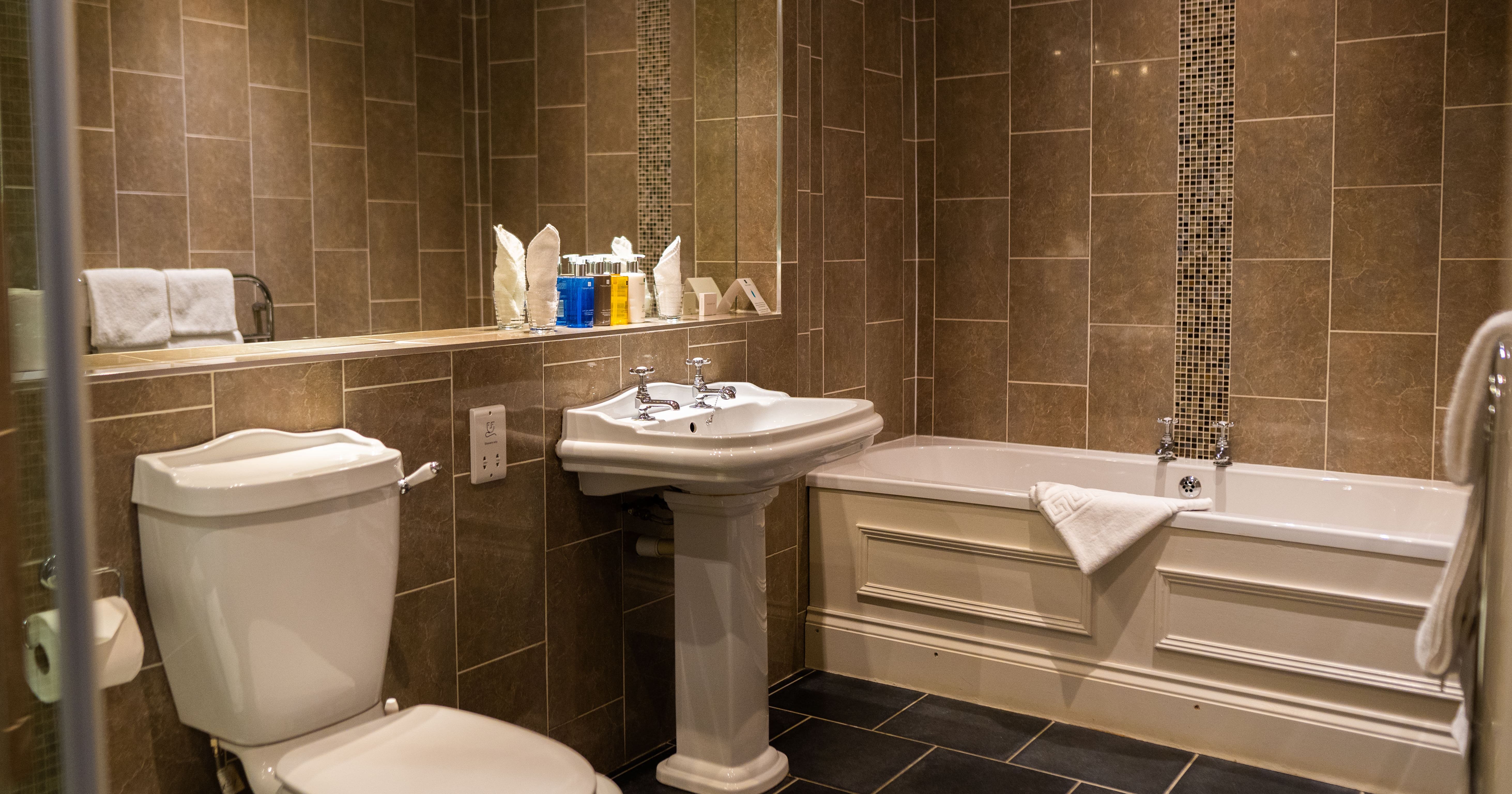 Bath and shower room with tiled floor and walls