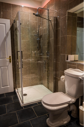 Bath and shower room with tiled floor and walls