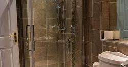 Bath and shower room with tiled floor and walls