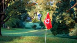 Close up of red flag on golf course