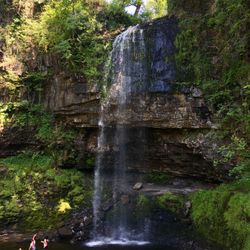 Waterfall in grass covered rocks
