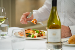 Man eating plate of food