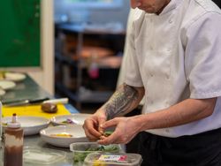 Chef preparing food on chopping board