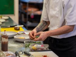 Chef preparing food on chopping board