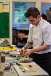 Chef preparing food on chopping board