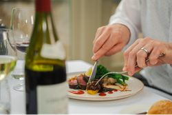 Man cutting into his food