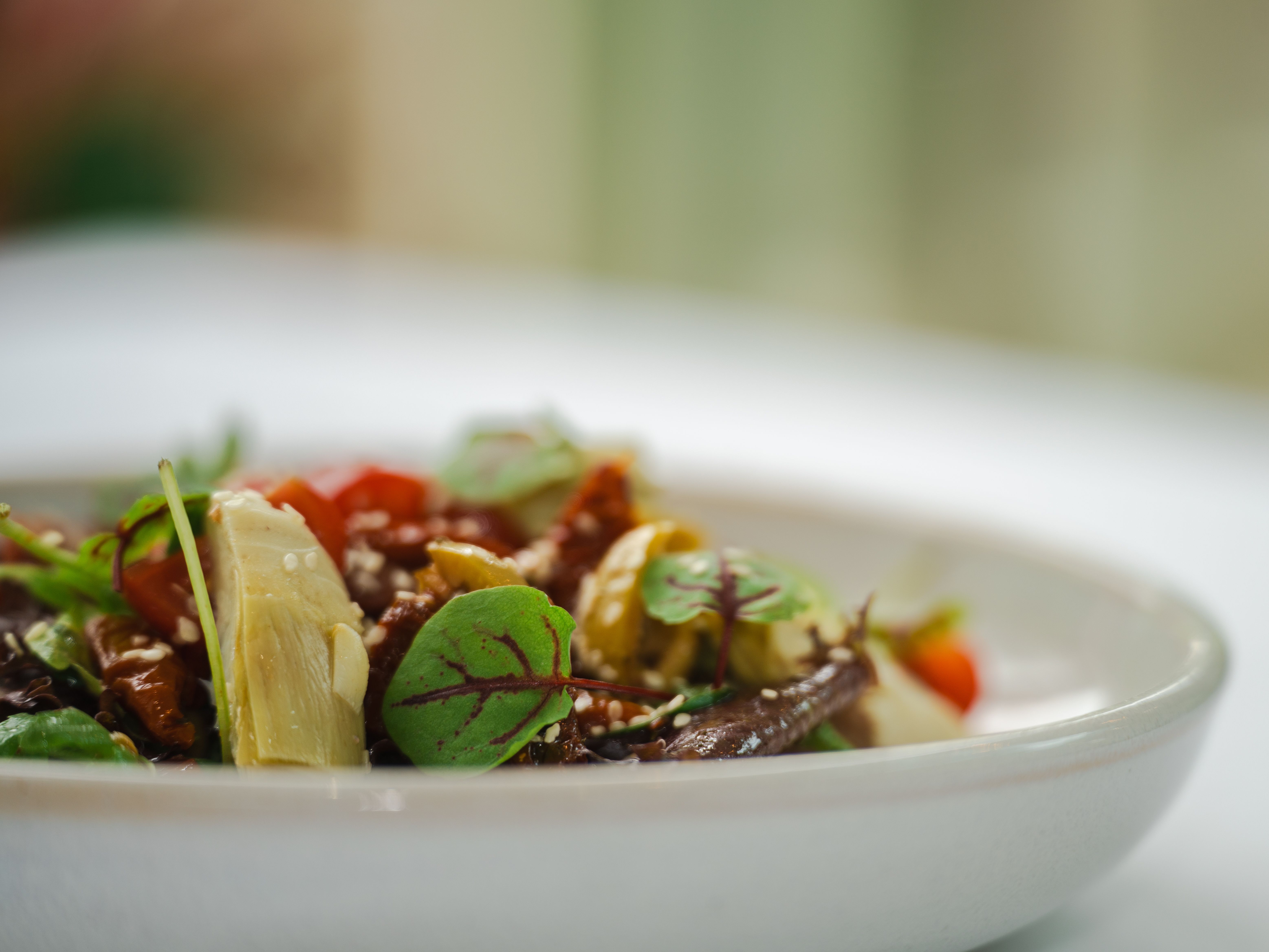 A salad in a white bowl