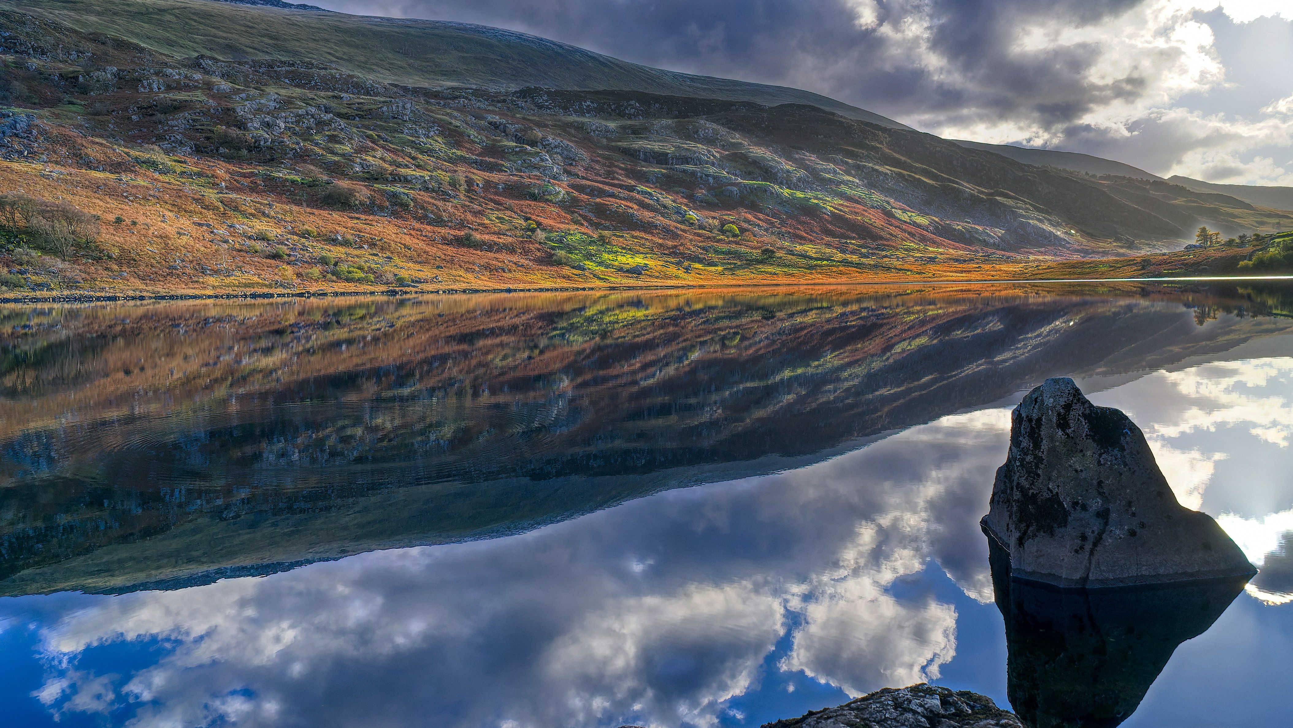 View of welsh valleys with lake in the foreground