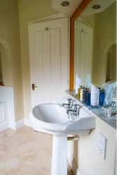 Bathroom sink in front of mirror