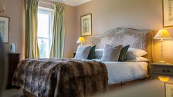 Bed with tartan blanket