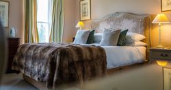 Bed with tartan blanket
