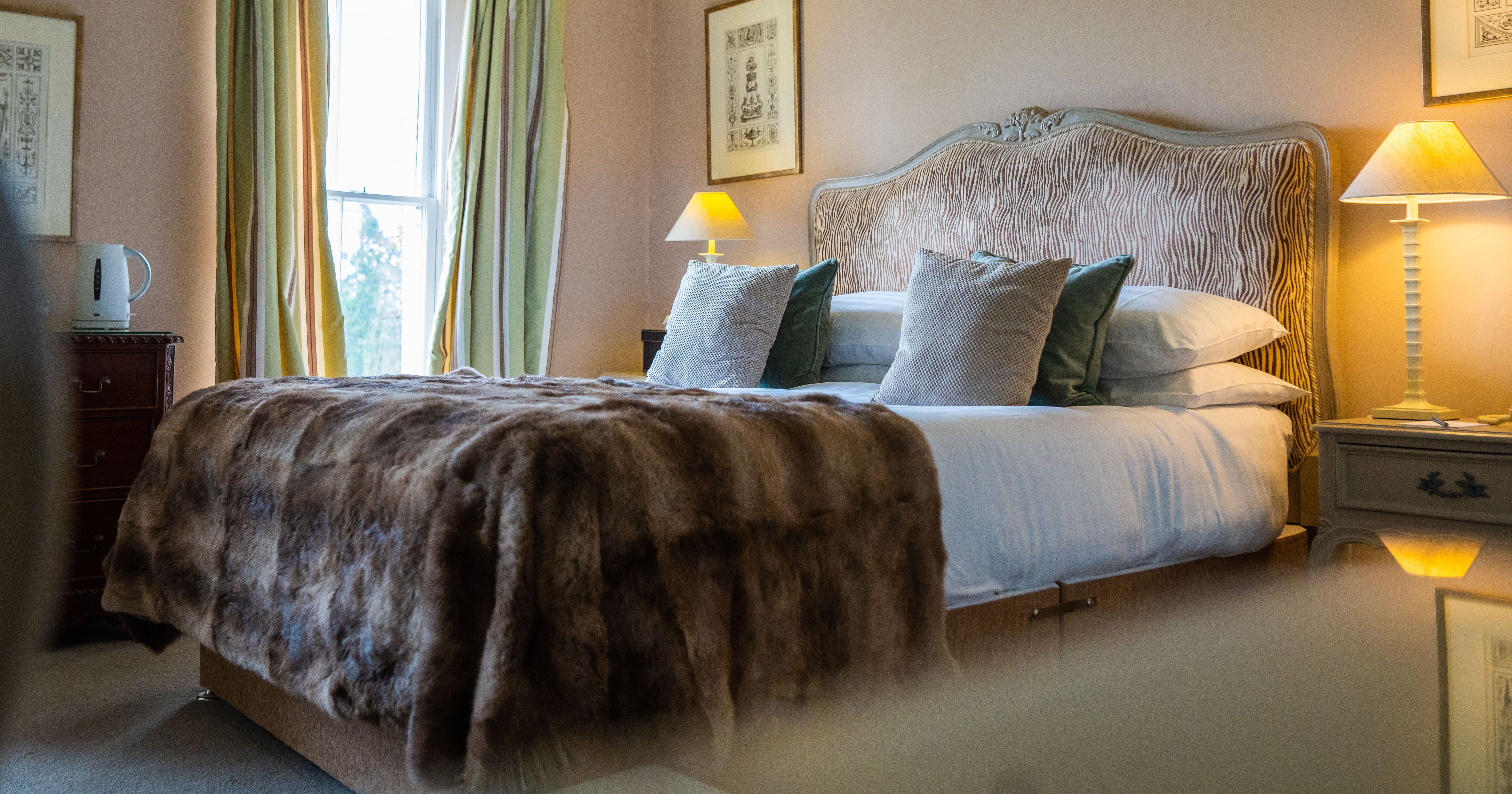 Bed with tartan blanket