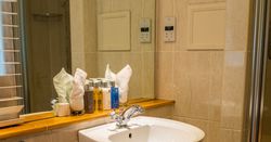 Bathroom sink in front of shower