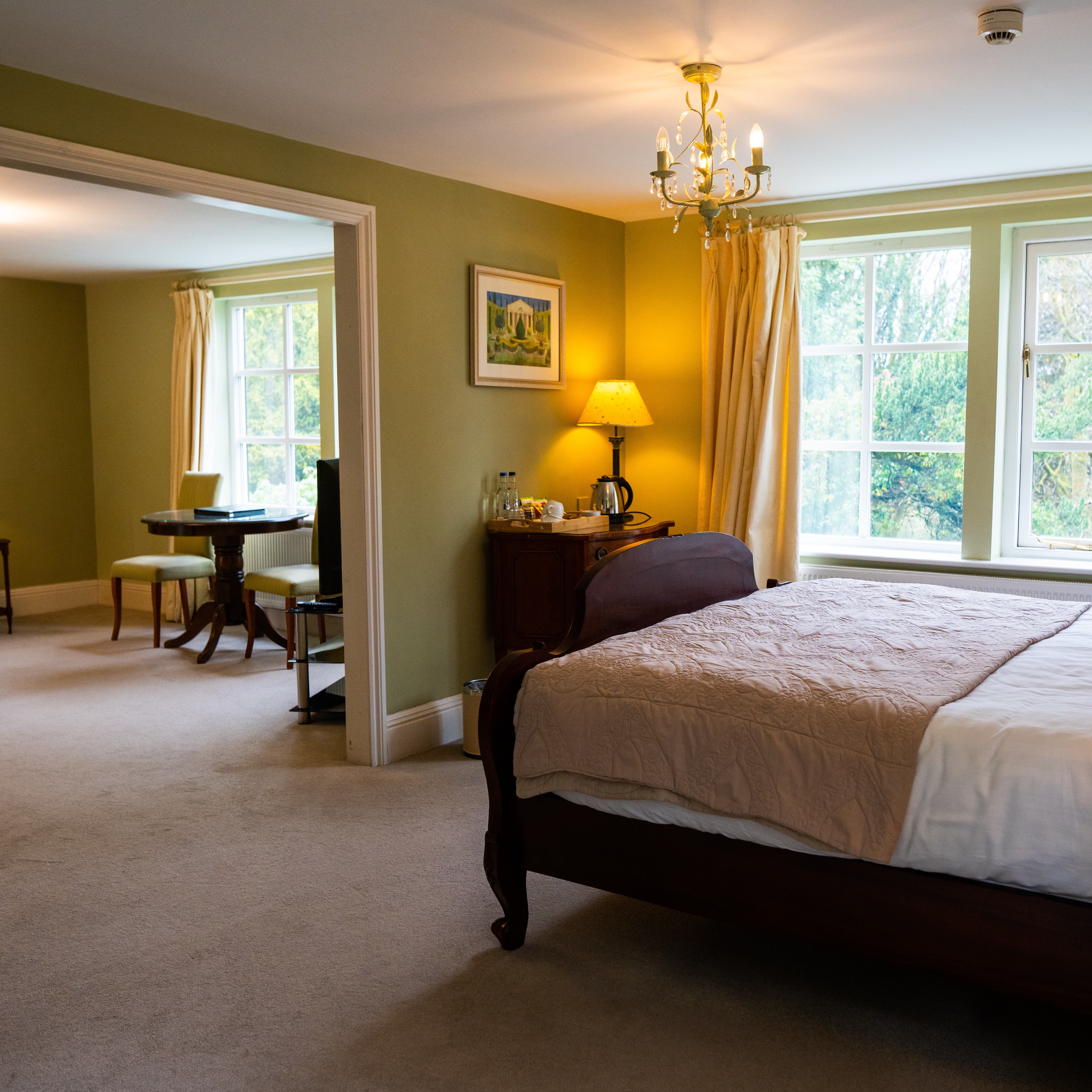 Bed with archway on to seating area