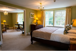 Bed with archway on to seating area