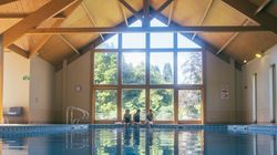 Pool view in front of tall window