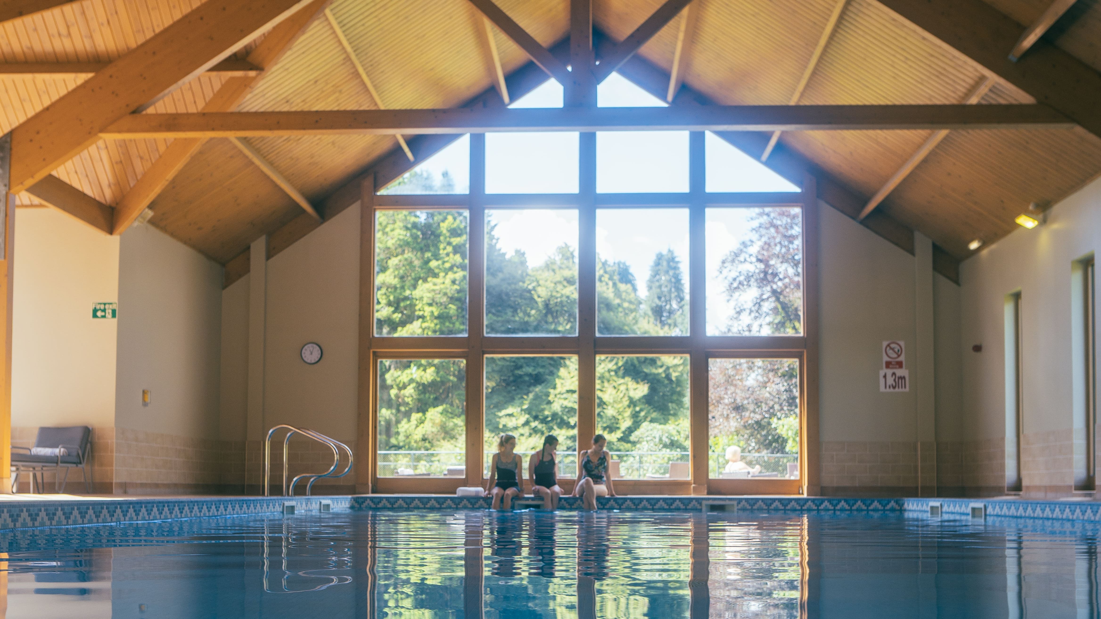 Pool view in front of tall window