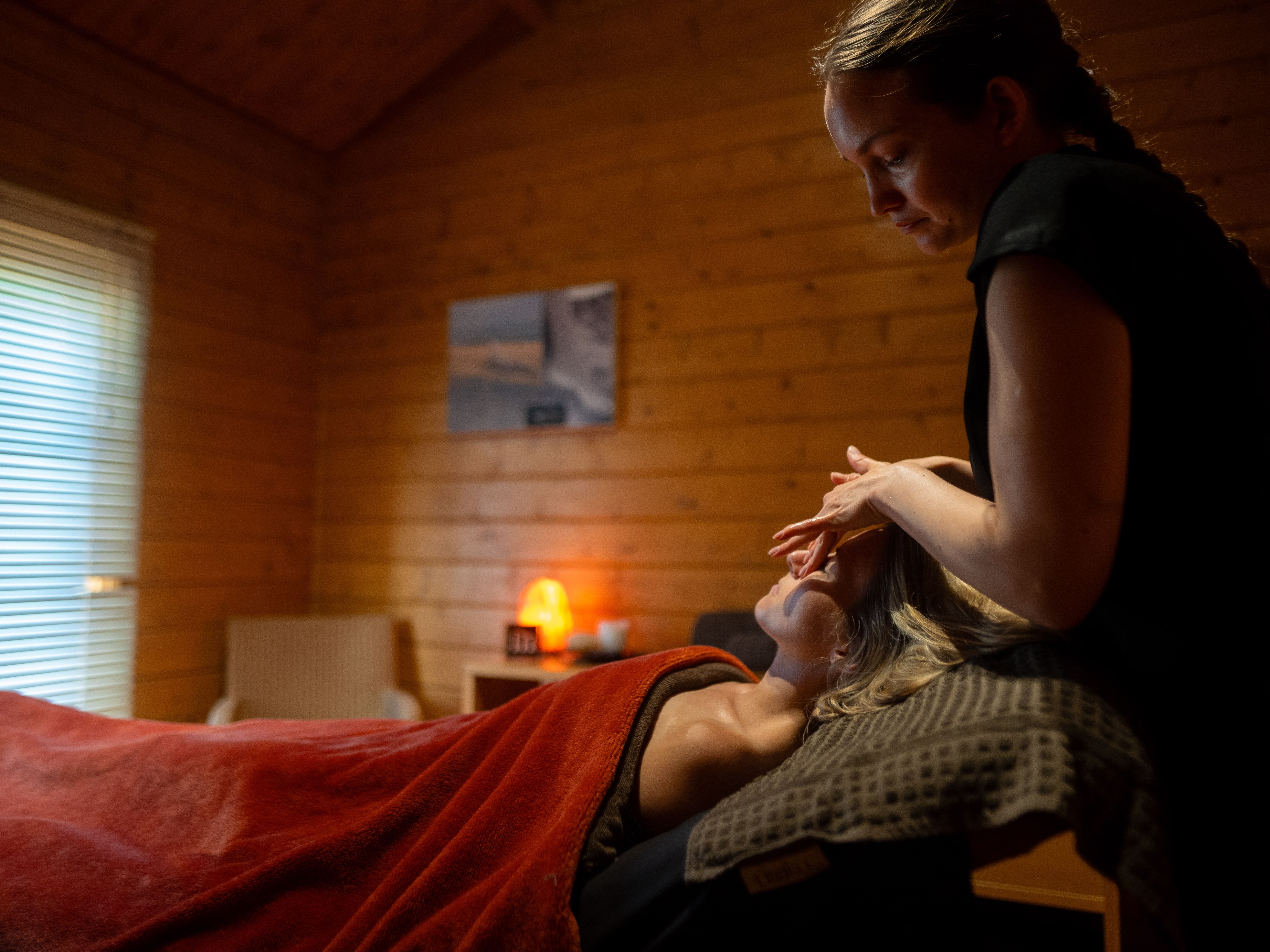 Lady laying down as she receives a spa treatment