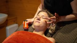 Lady receiving facial treatment