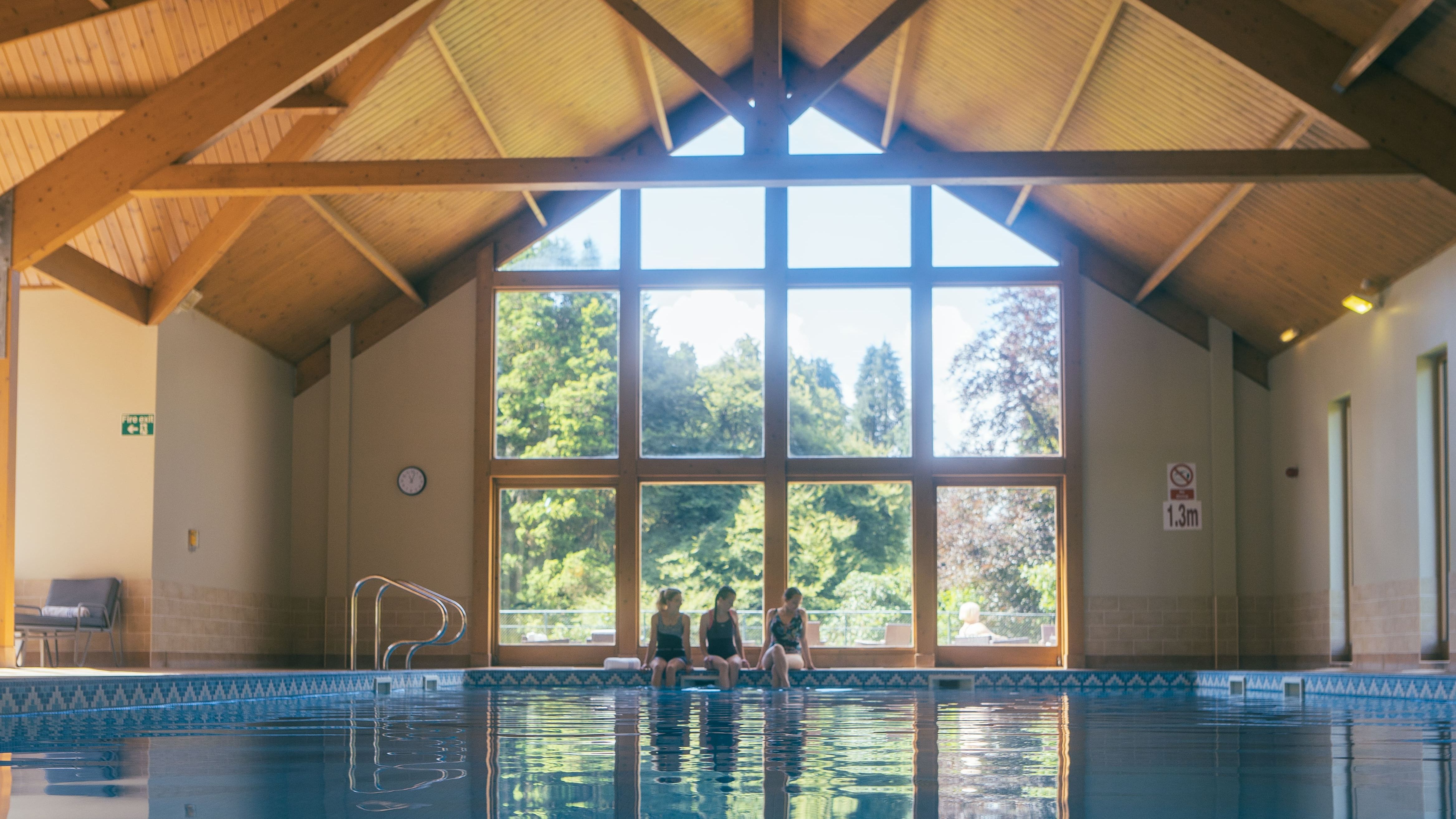 Swimming pool with large window behind