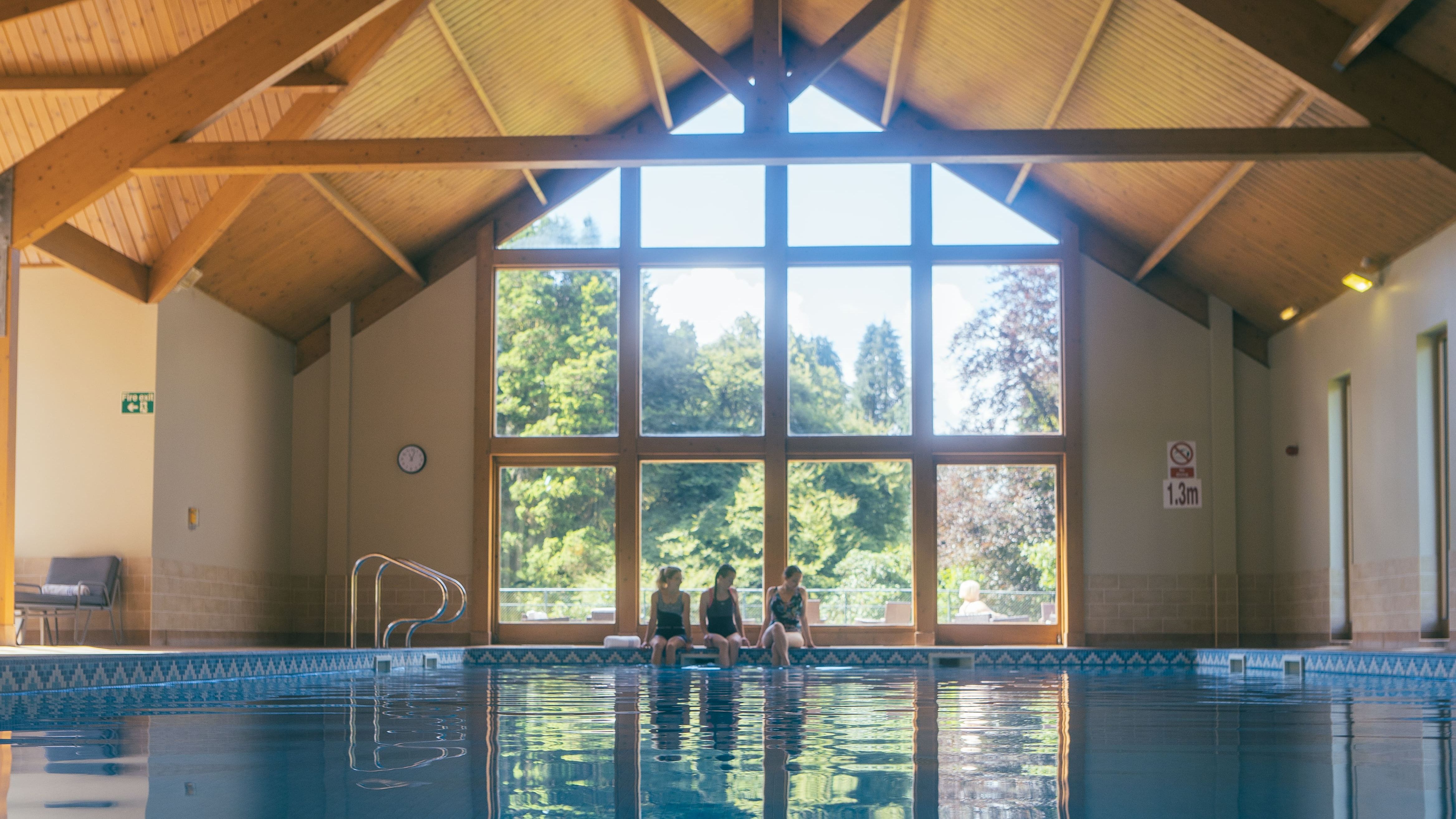 Swimming pool with large window behind