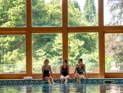 Swimming pool with large window behind