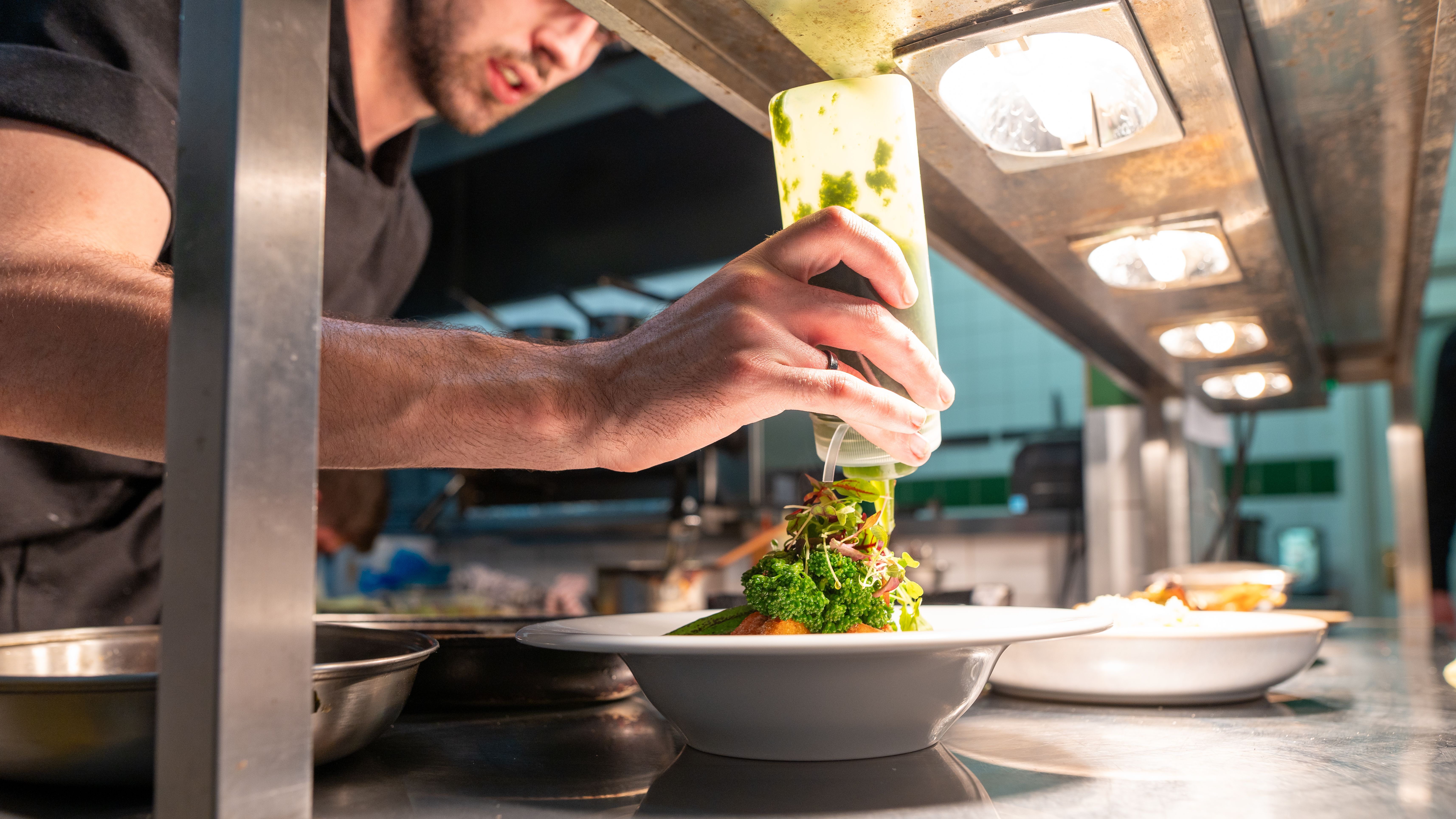 Chef creating plate of food