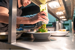 Chef creating plate of food