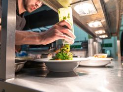 Chef creating plate of food