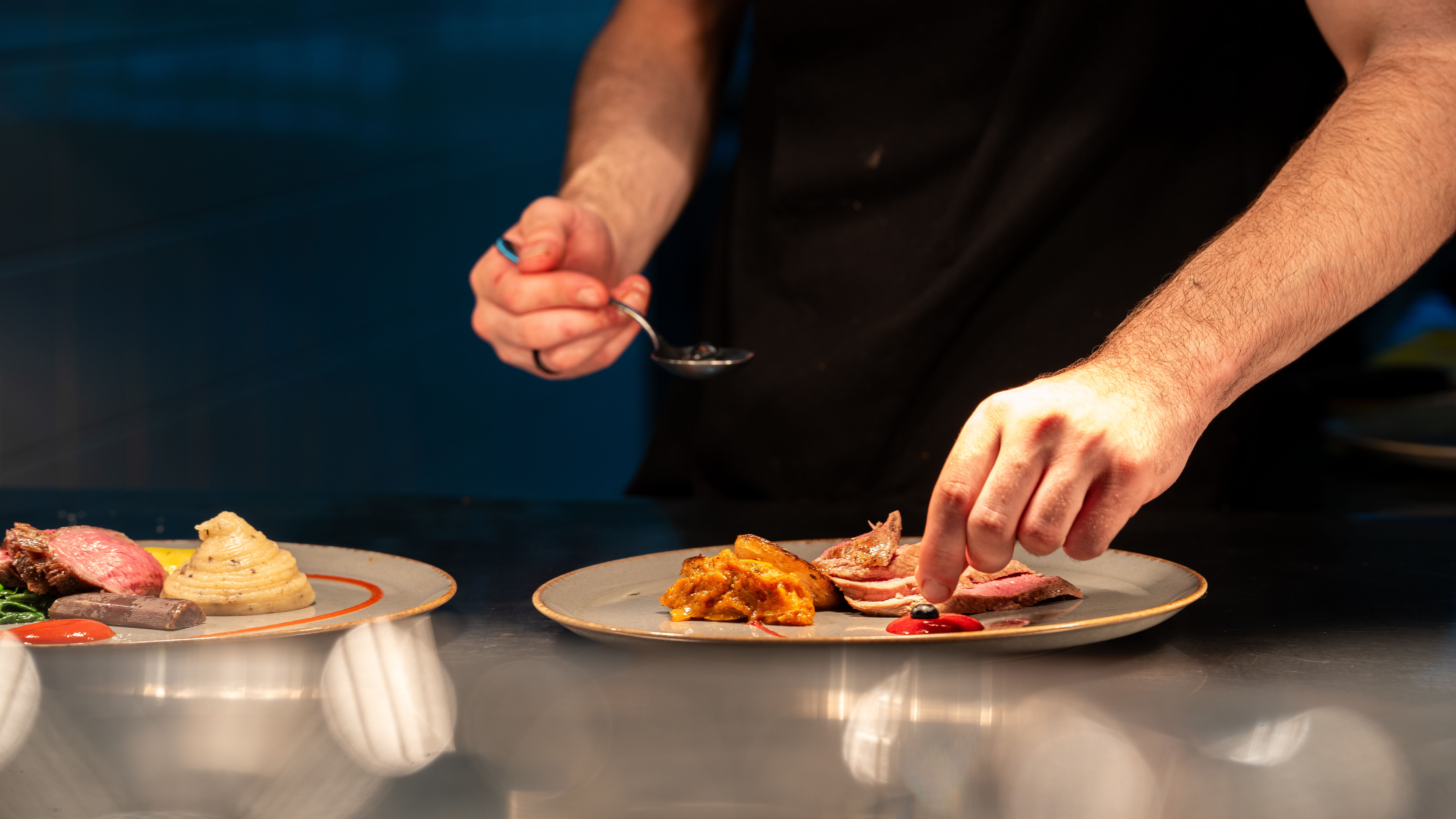 Chef assembling plate of food