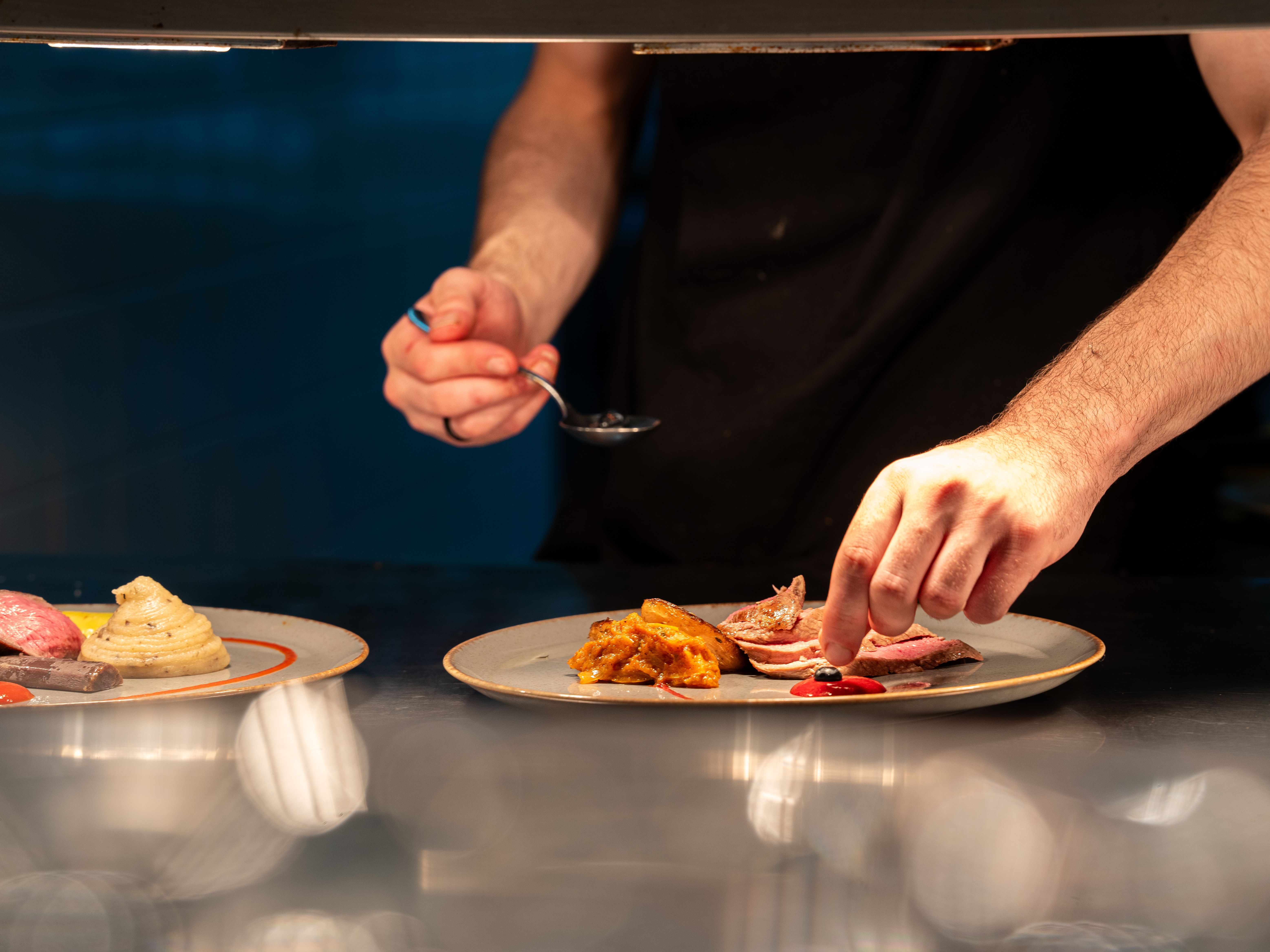 Chef assembling plate of food