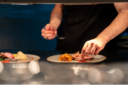 Chef assembling plate of food