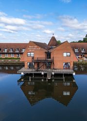 Lakeside International Hotel building over water with clear reflection
