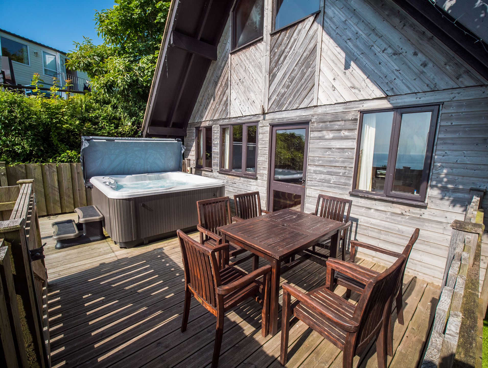 Ocean View Lodge with hot tub and decking with sea views