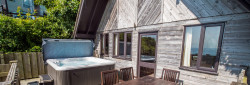 Ocean View Lodge with hot tub and decking with sea views