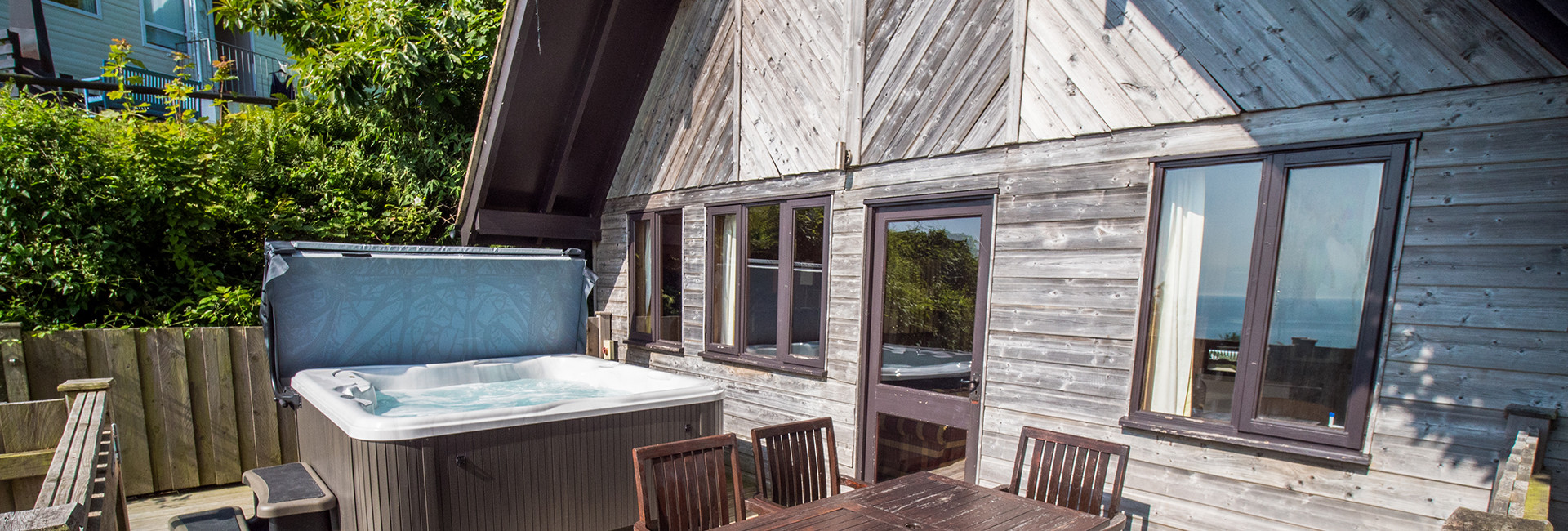 Ocean View Lodge with hot tub and decking with sea views
