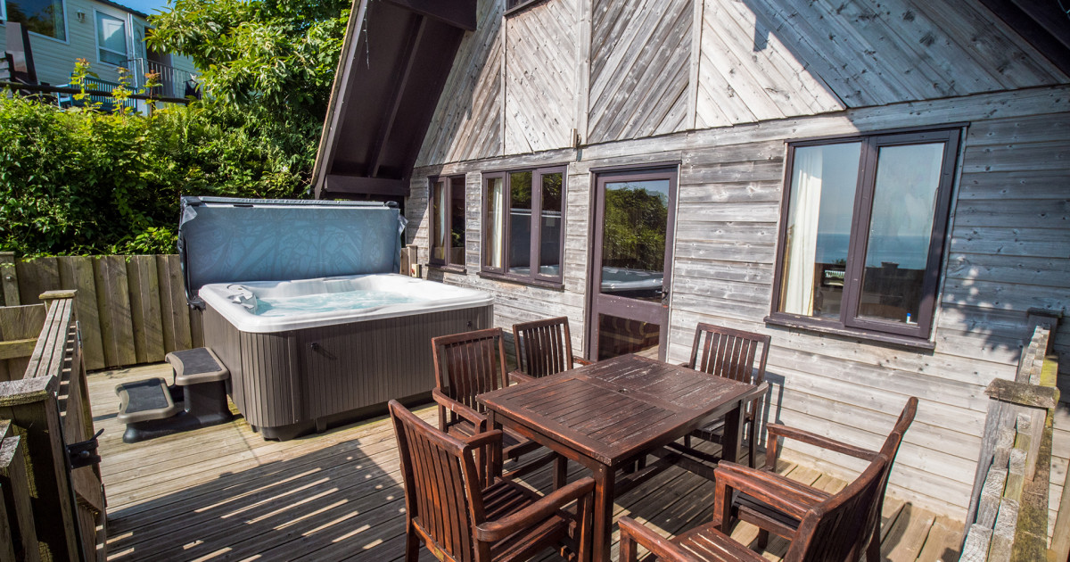 Ocean View Lodge with hot tub and decking with sea views