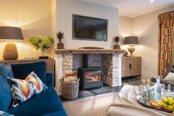 Cozy living room with log burner fireplace and stylish decor