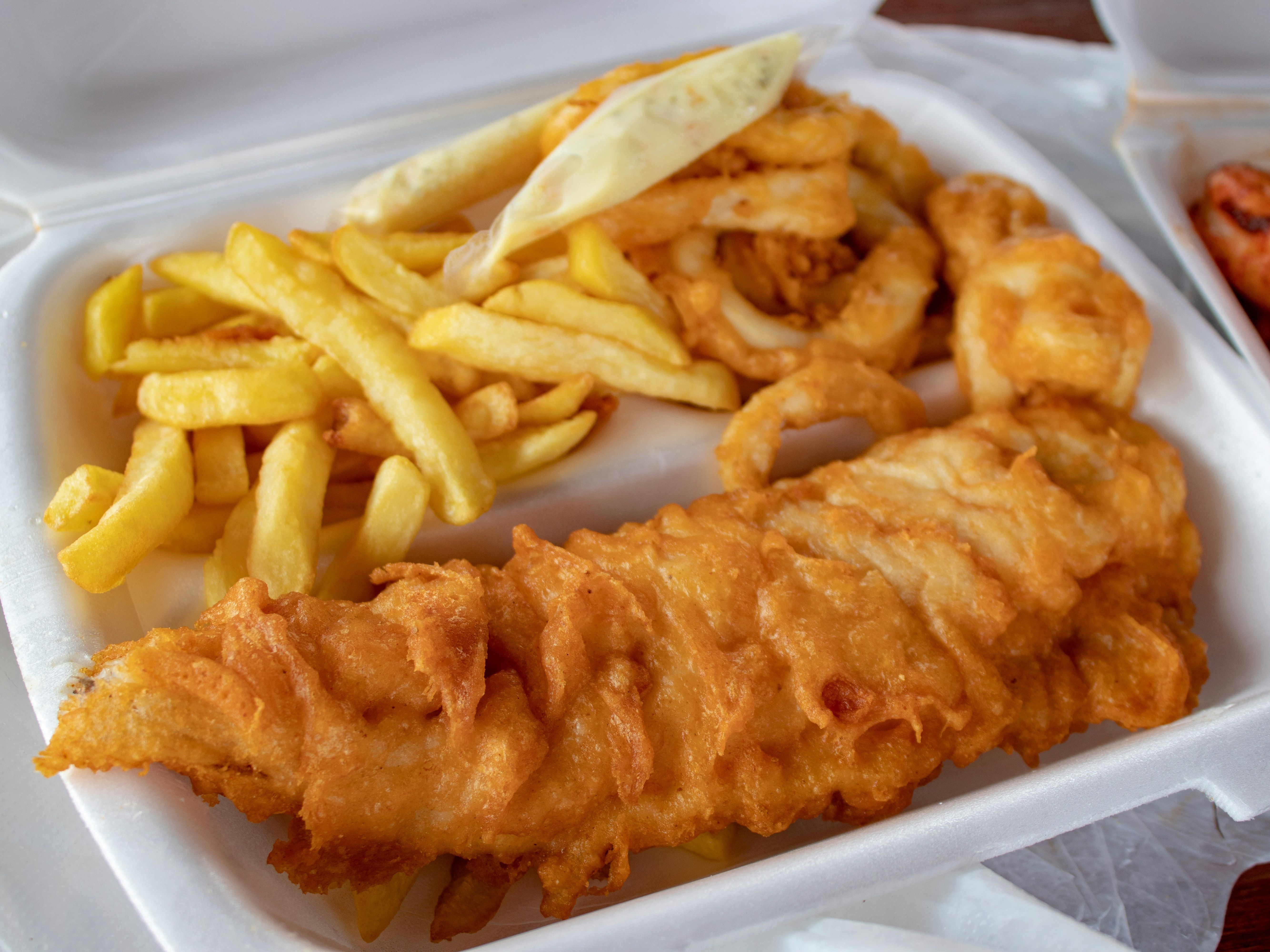 Fish and chips in a takeout container