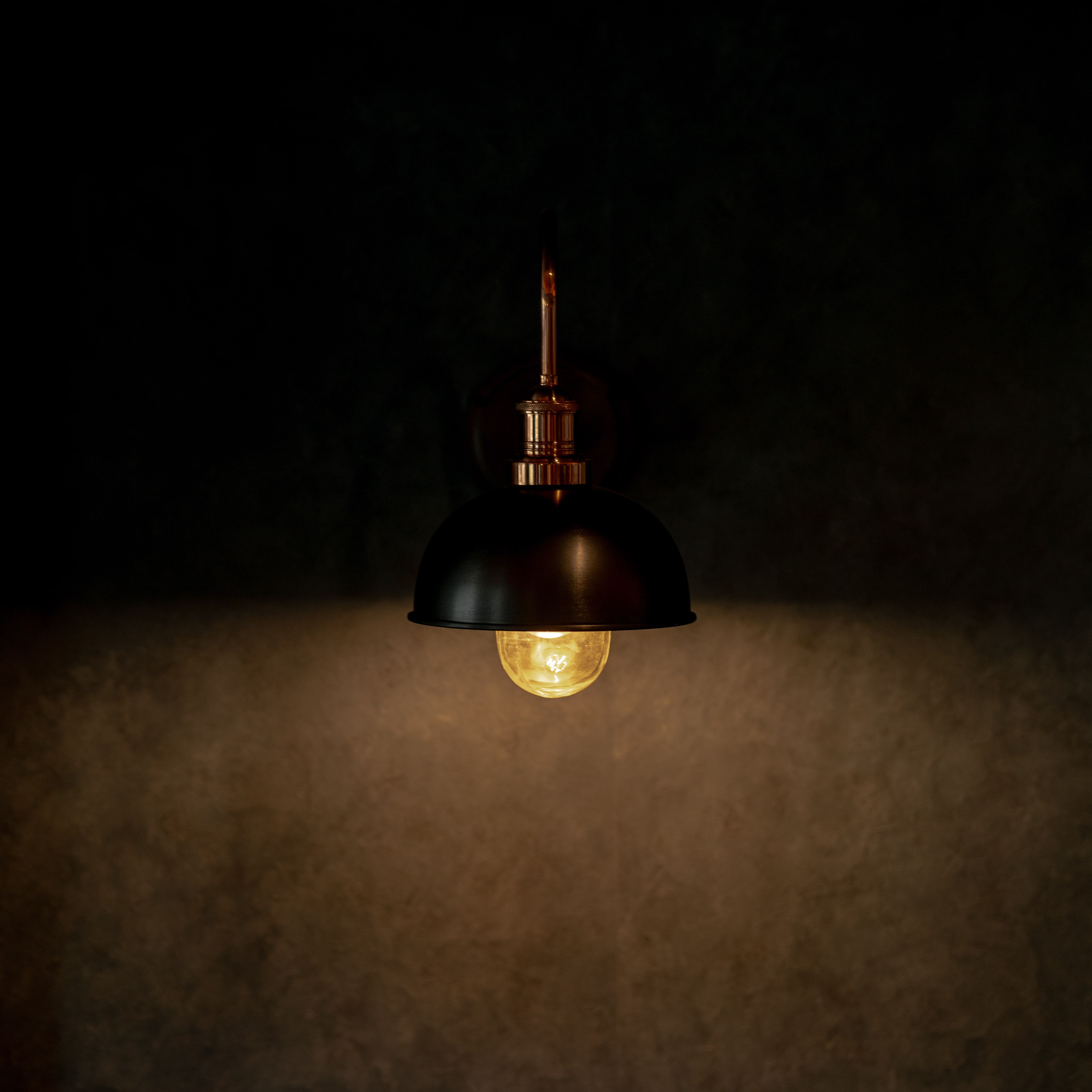 Vintage wall lamp glowing in the dark