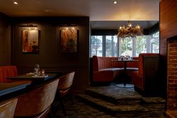 Cozy restaurant interior with booth seating and warm lighting